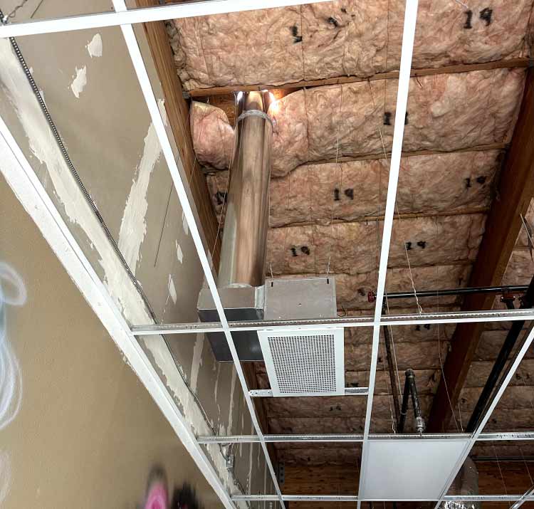 Commercial ductwork installation underway in a large Central Valley retail building