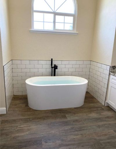 Custom-designed shower with body jets and high-end plumbing for optimal water pressure
