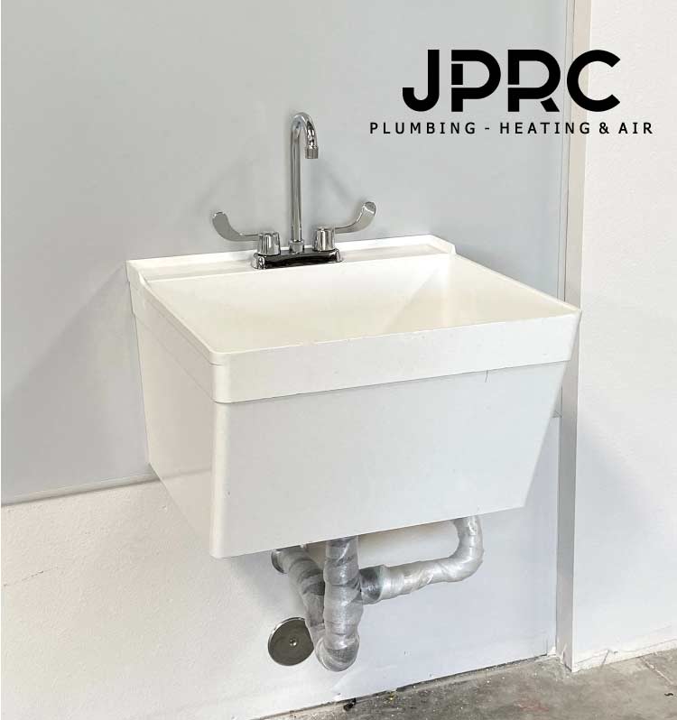 Professional plumbers to repairing a leaky faucet in a Fresno home. faucet repair services.