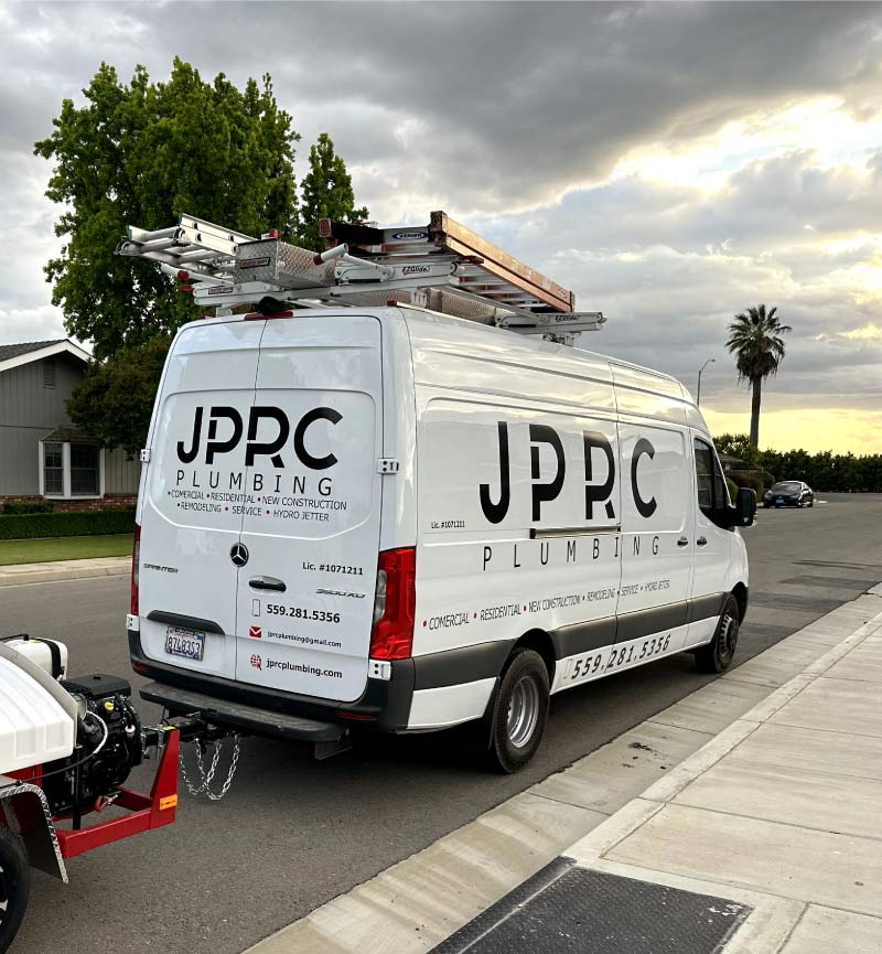 JPRC Plumbing & HVAC company van parked on a residential street ready for plumbing service call in fresno ca