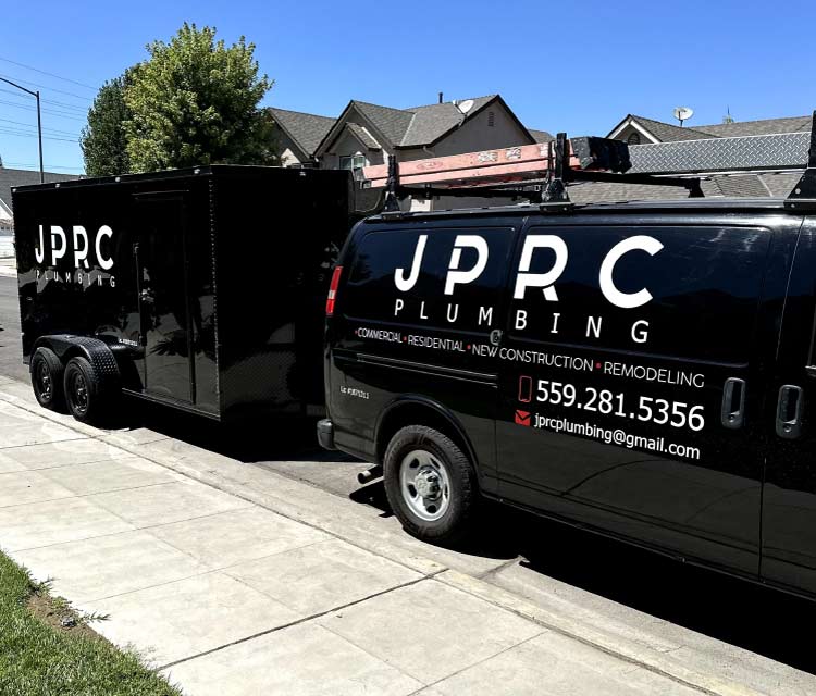 Technicians to performing routine furnace maintenance in a residential home in Fresno, CA