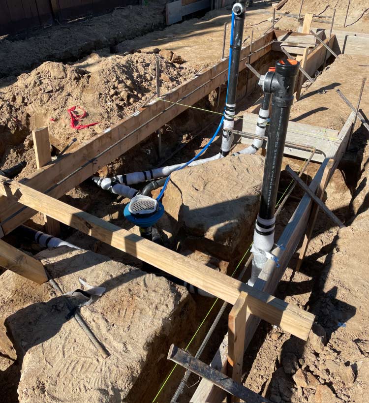 JPRC Plumbing & HVAC technician repairing a water leak in a construction site