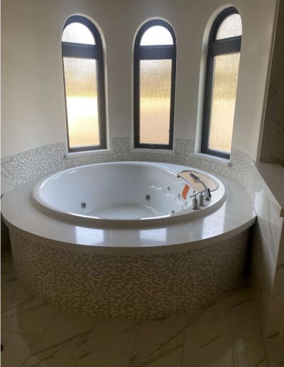 plumbing work finished on a modern bathroom with spa