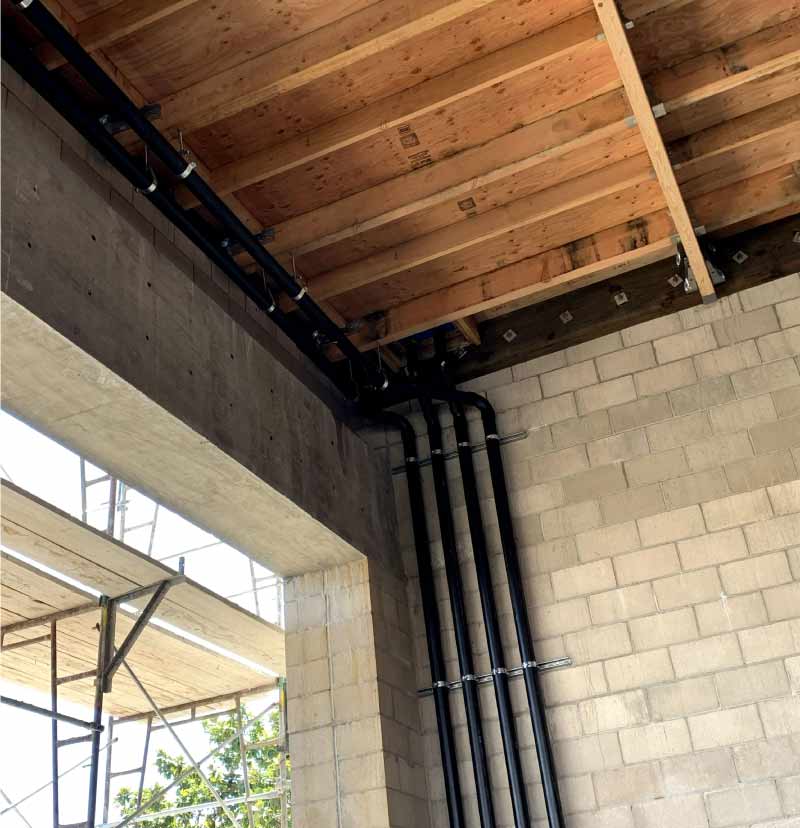 Commercial plumbing installation in progress inside a Central Valley office building