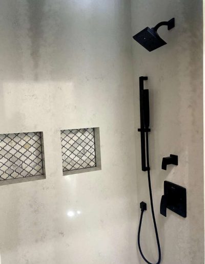 Modern walk-in shower with sleek fixtures and efficient water drainage system
